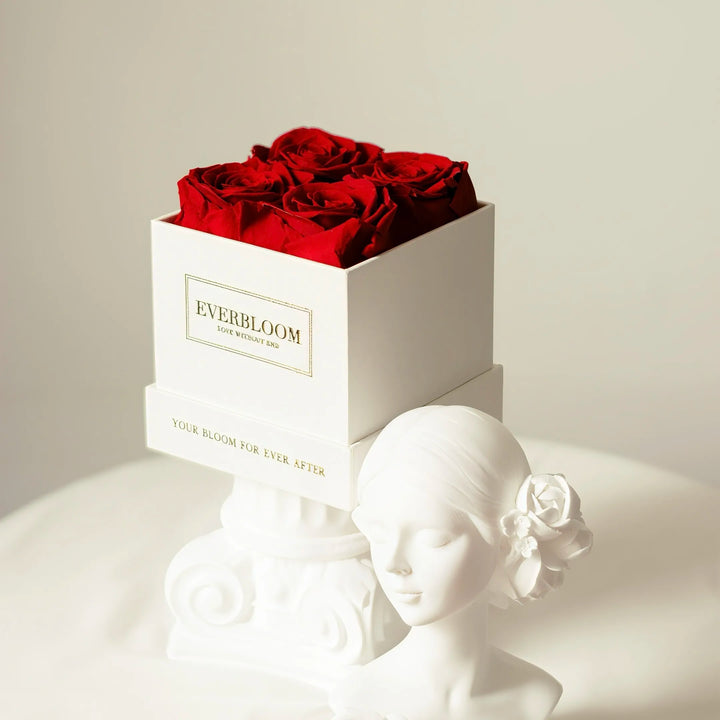 Elegant preserved roses arranged in a refined white square box