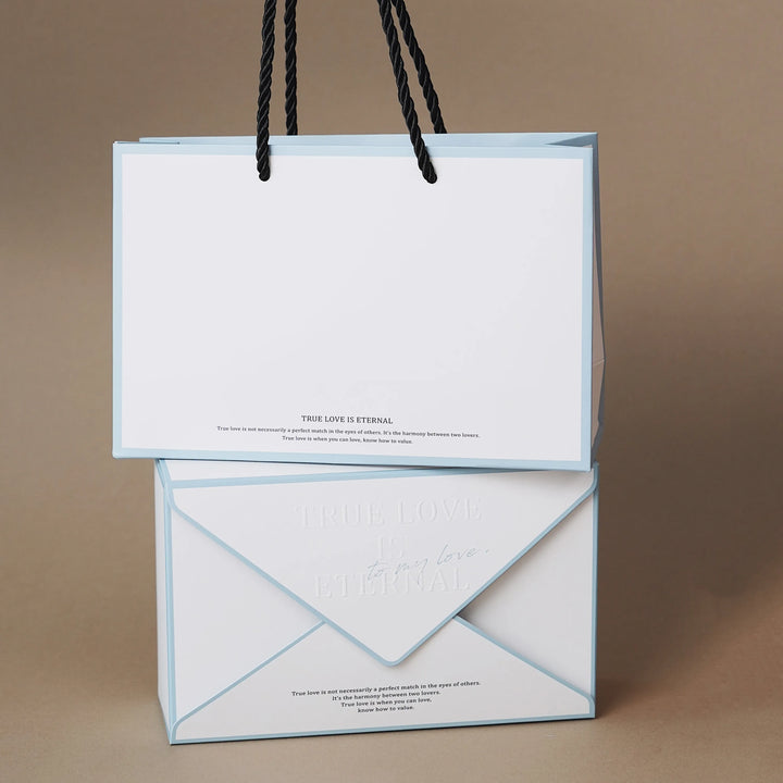 Blue envelope-style packaging for the Everlasting Flora Envelope purple edition