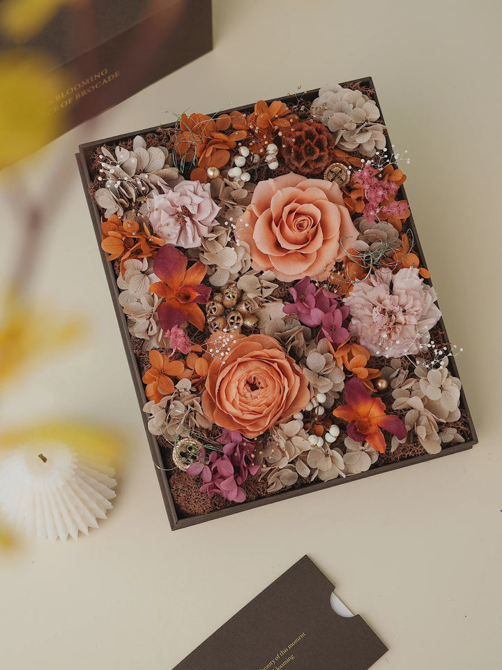 Everlasting Flora Book featuring preserved flowers in taupe and burnt orange tones