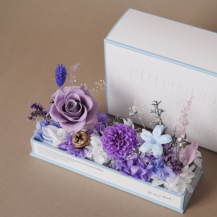 Purple preserved flower arrangement in the Everlasting Flora Envelope, without acrylic lid