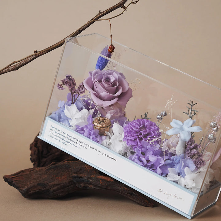 Everlasting Flora Envelope with purple preserved flowers in clear acrylic box and blue envelope base