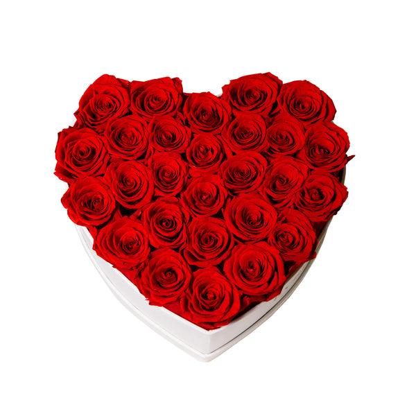 Frontal view of upright preserved roses arranged in a heart-shaped gift box