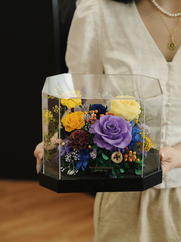 Person holding octagon preserved flower box in Monet’S Bloom Purple & Yellow