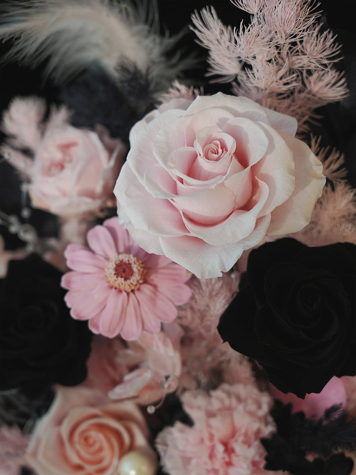 Close-up of preserved flowers in Dusky Romance Pink & Black