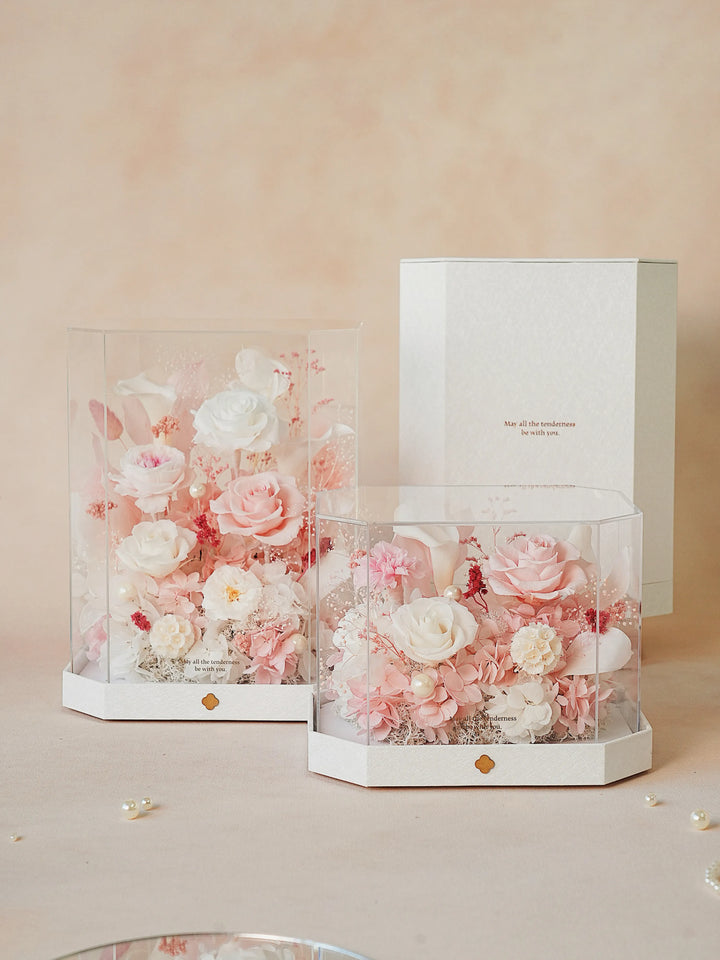Two sizes of octagon acrylic boxes with preserved flowers in Ballet Petals White and Pink
